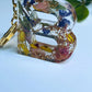 Mixed Color Flowers Gold Chain Cap Letters